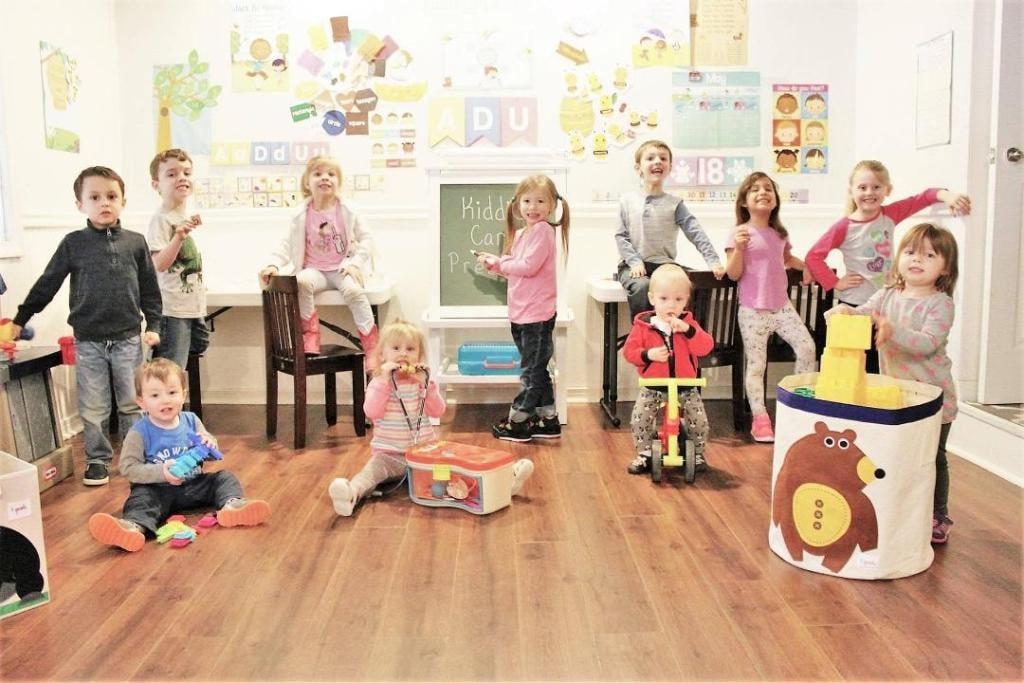 Children enjoying outdoor play-based learning at Kiddie Care home daycare in Damascus MD